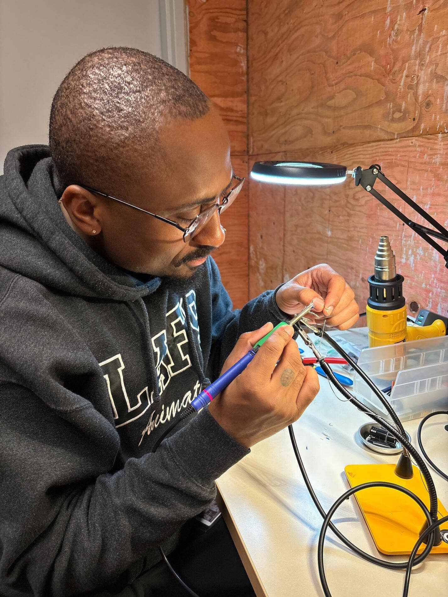 A Workforce Development Program participant practices welding skills. 