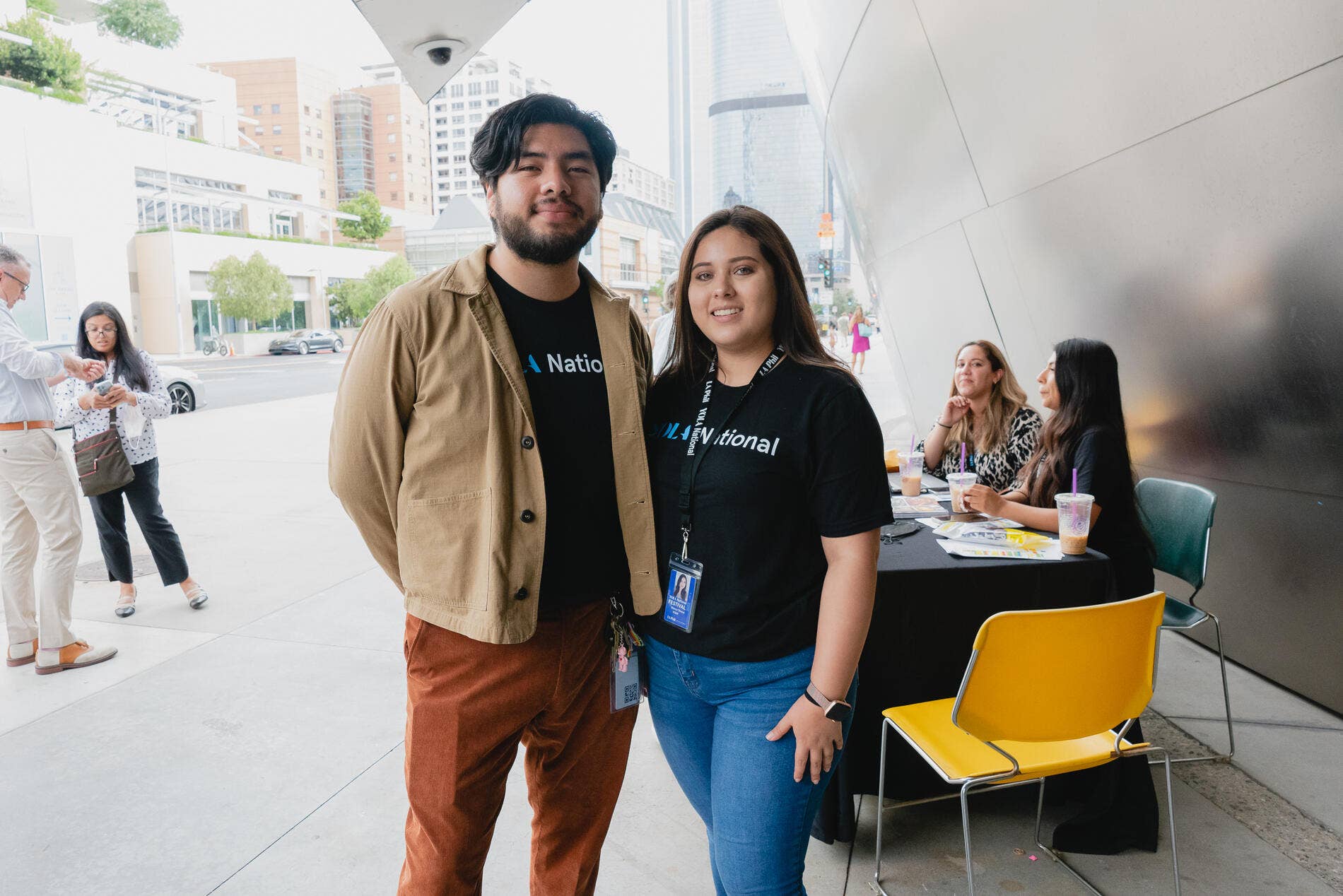 Josue May poses with another volunteer outside of the Walt Disney Concert Hall during the Career Summit. 