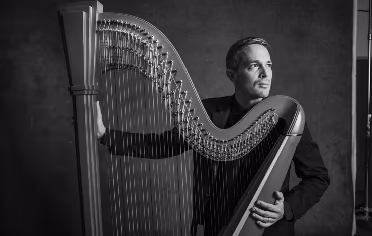 black & white photo of Emmanuel-Ceysson with harp