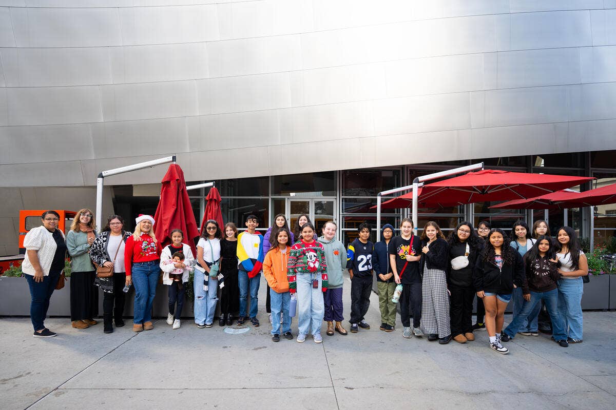 Children from a school group in front of Walt Disney Concert Hall on December 13, 2025.
