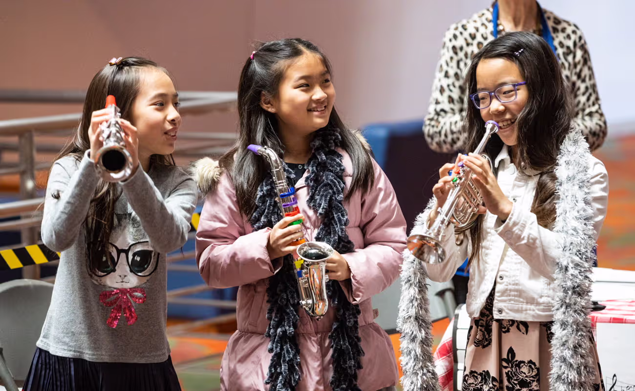 small children playing small instruments