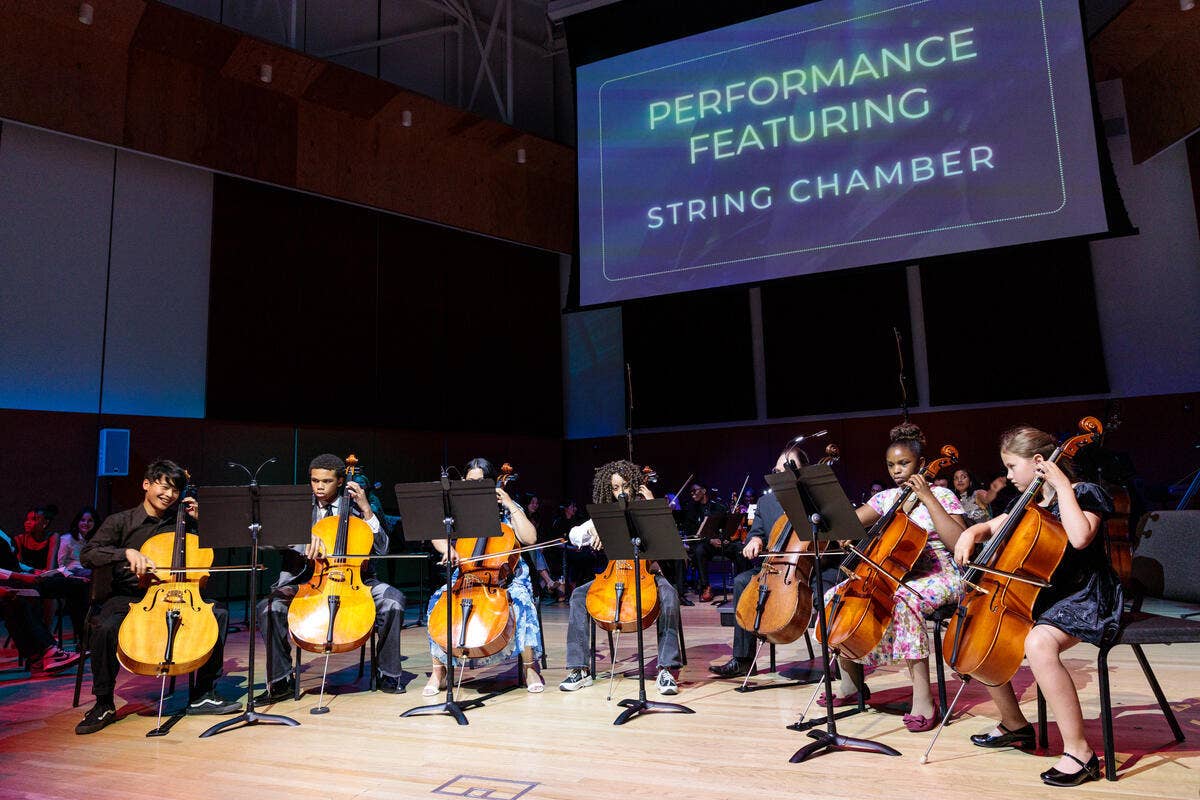 YOLA String Chamber students perform on stage. 