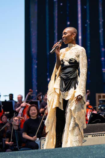 Cynthia Erivo stands on stage to sing during Coachella with the Los Angeles Philharmonic in the background.