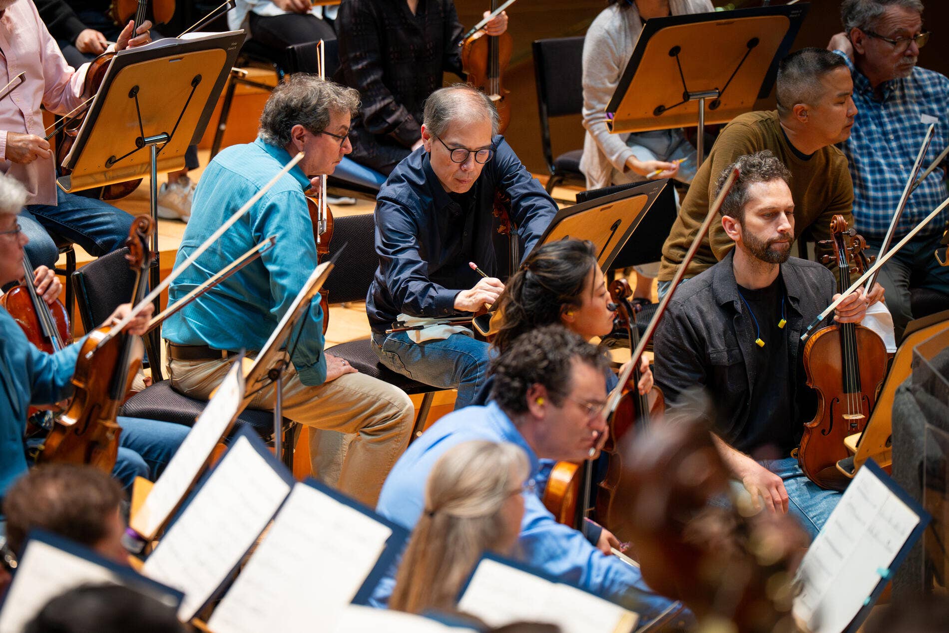 hui liu taking notes during rehearsal 