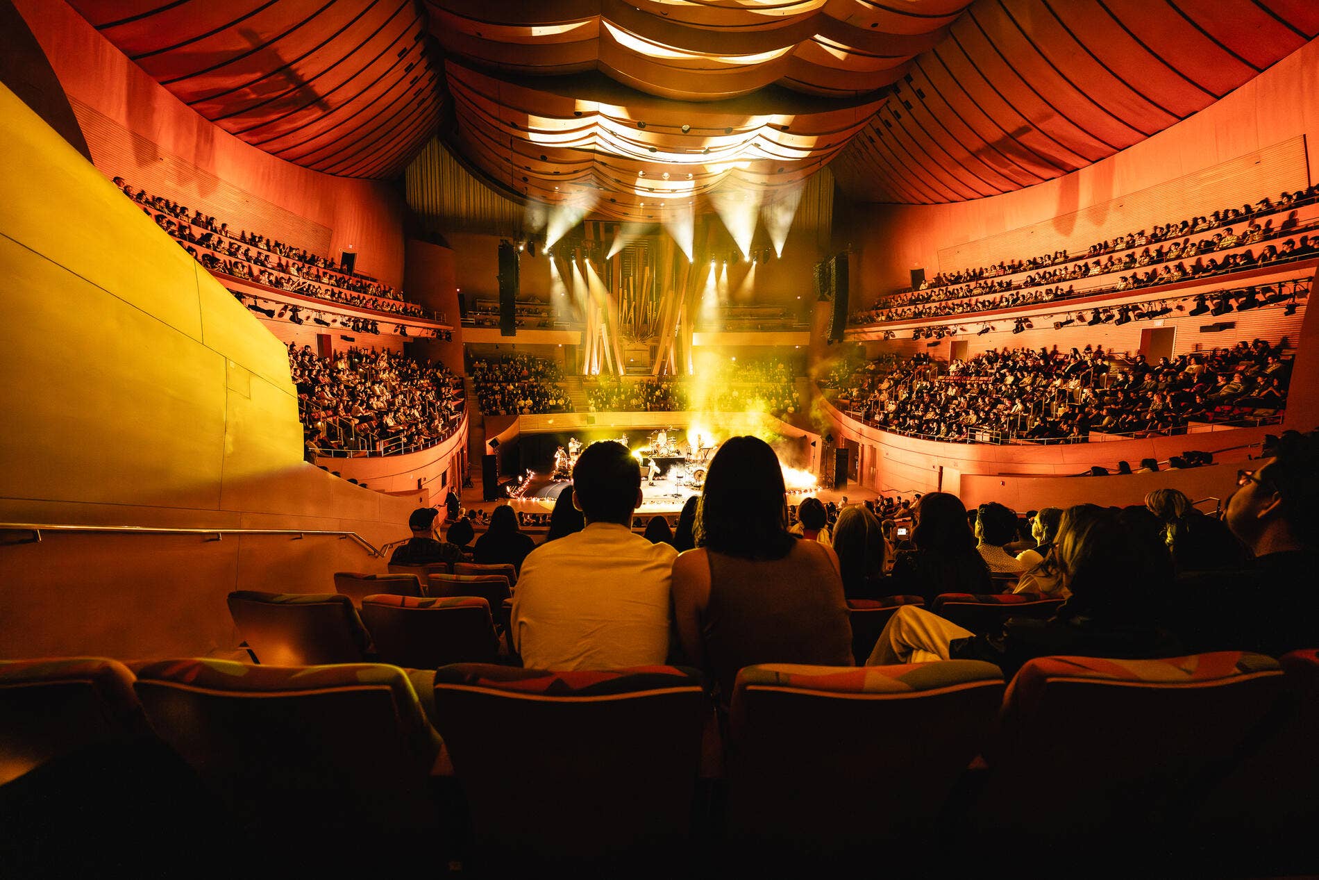Audience members enjoying a performance