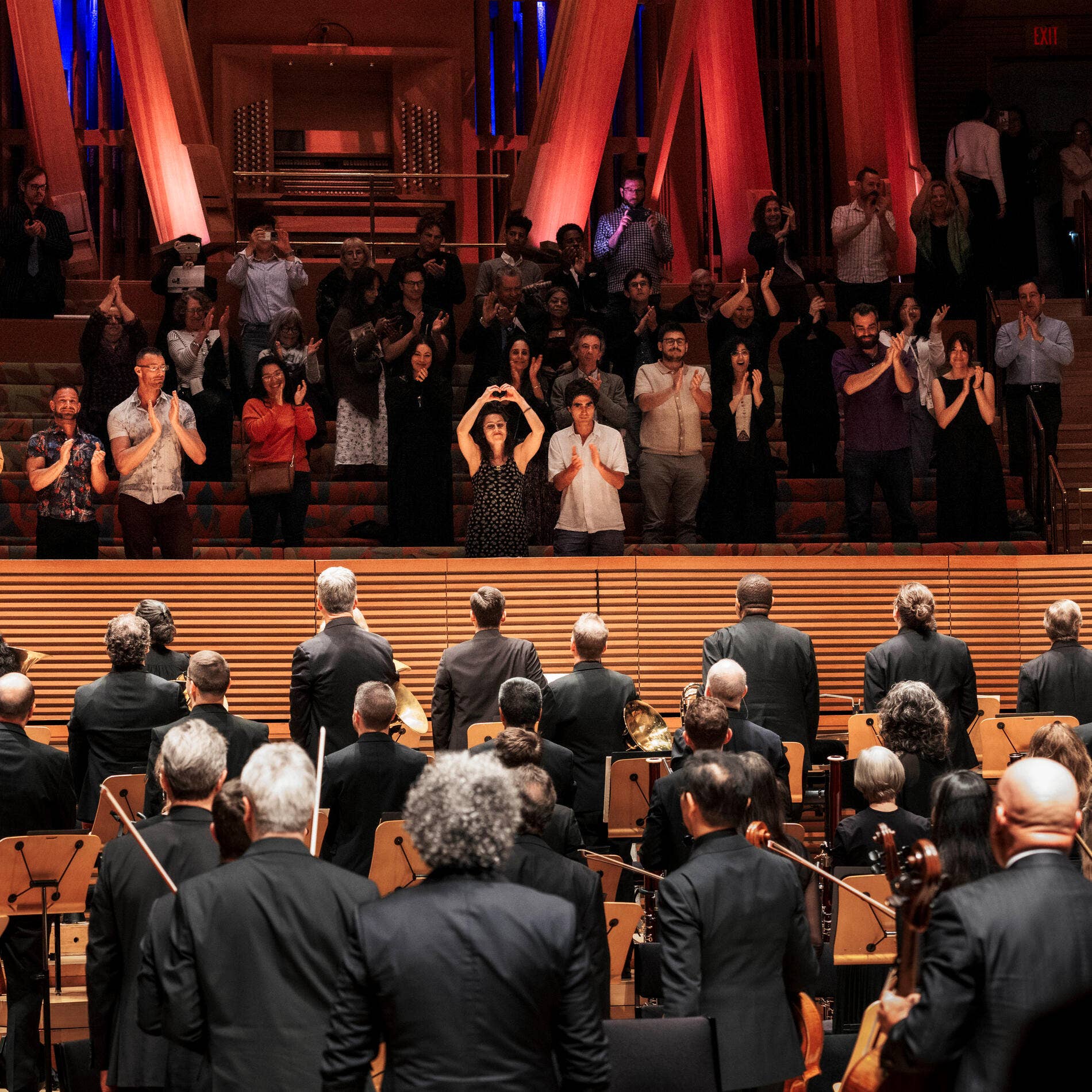 Audience members enjoying a performance