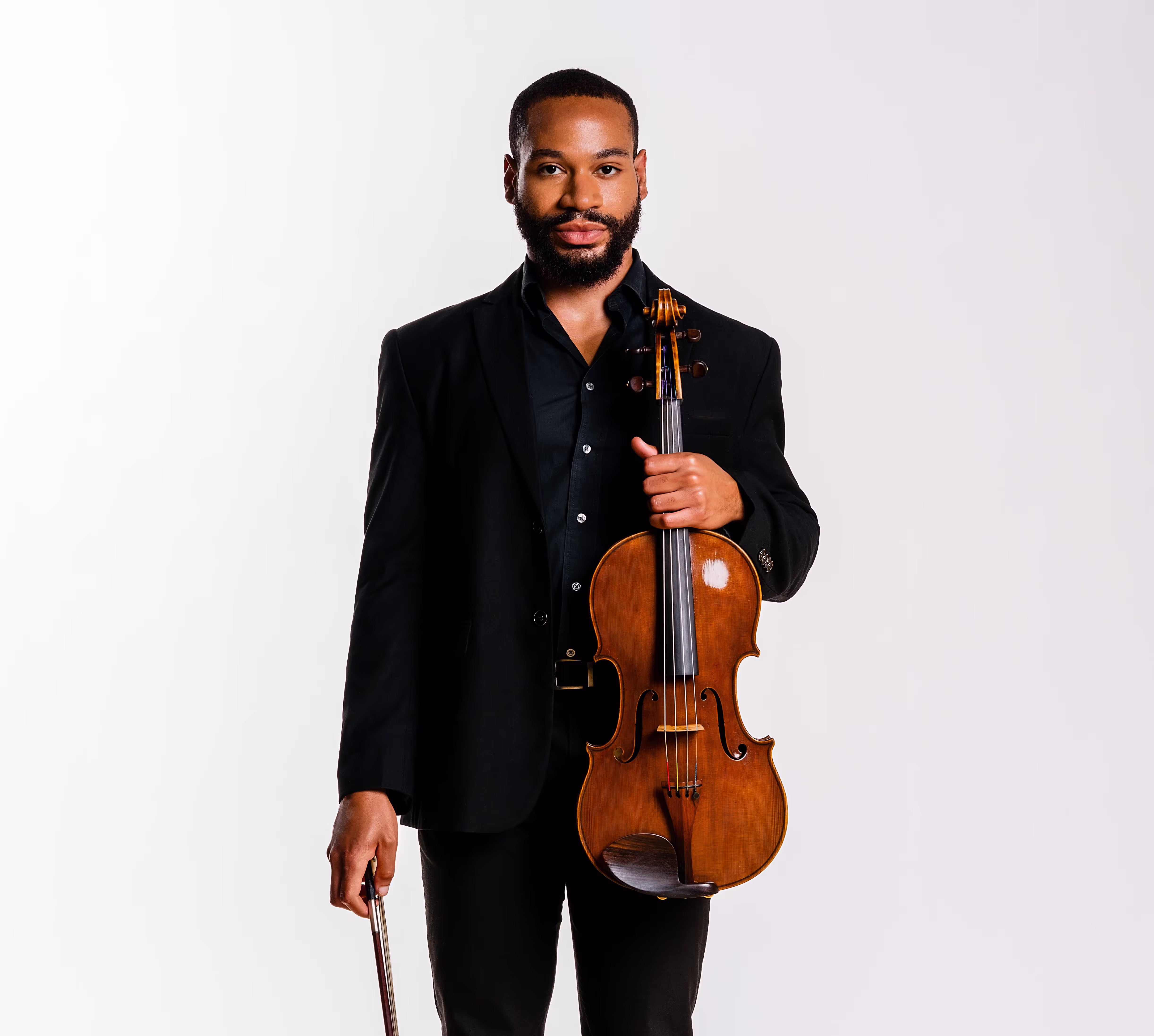 headshot of man holding viola