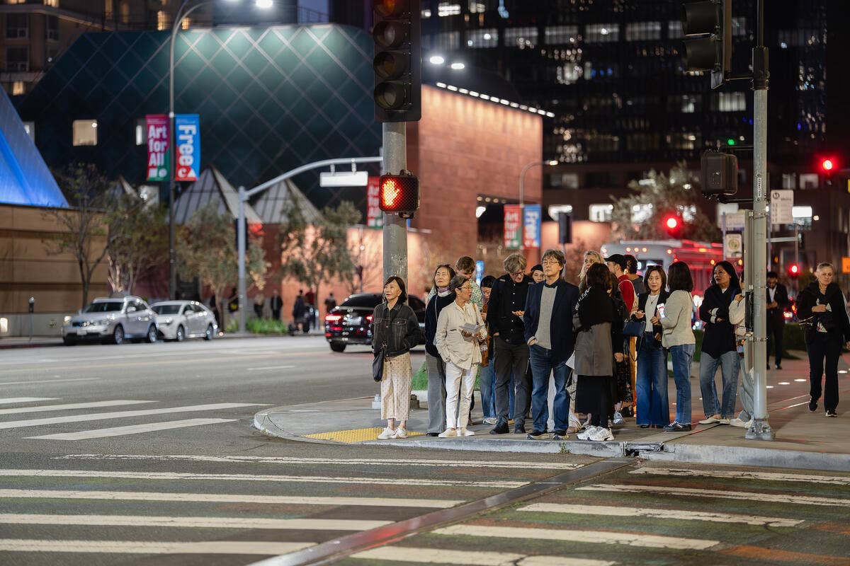 Attendees crossing the street from MOCA