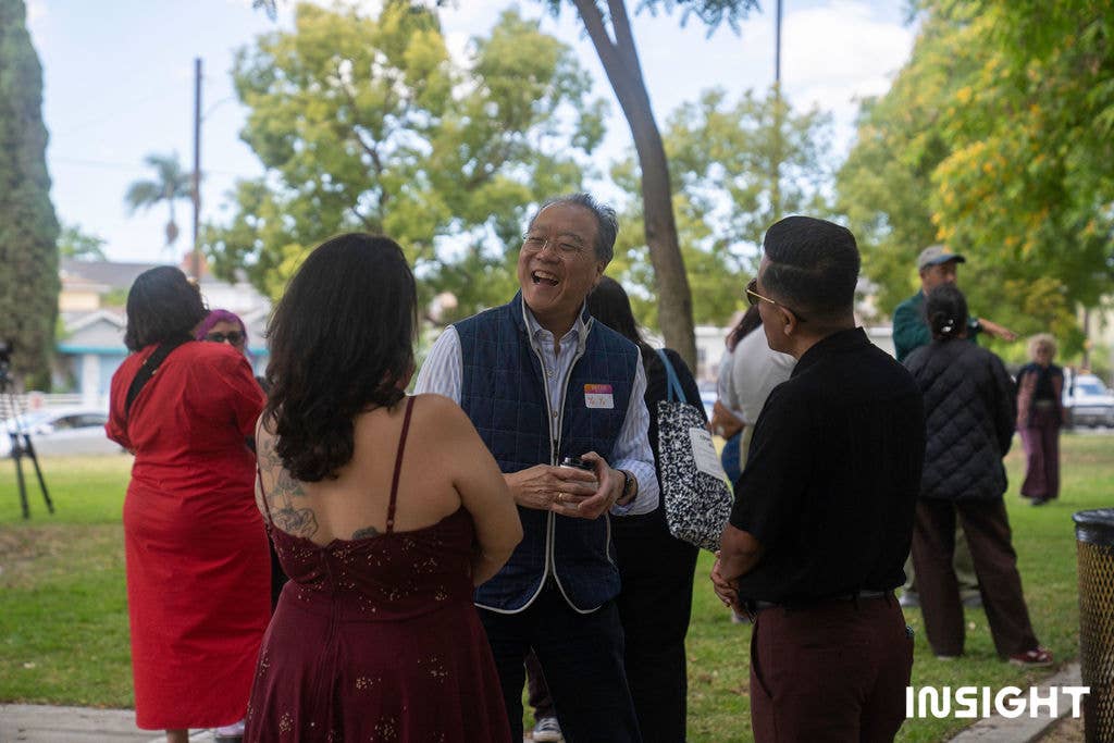 Yo-Yo Ma speaking to attendees outdoors at Riverfront Park.
