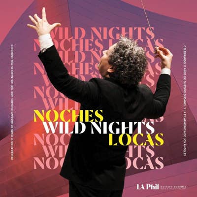 Conductor raises both hands in front of colorful Wild Nights, Noches Locas poster with LAPhil logo.