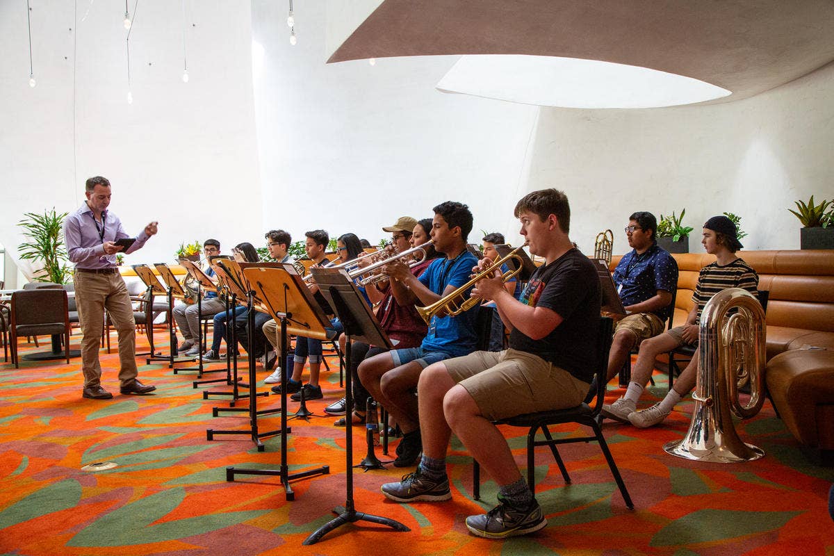 YOLA National students play their instruments during rehearsal at the Walt Disney Concert Hall.
