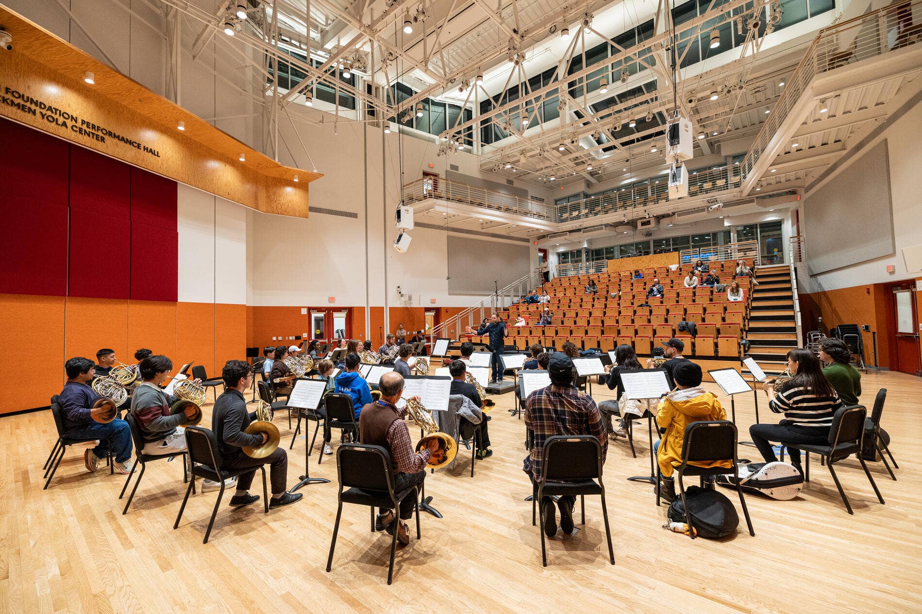 The Edgerton Foundation Performance Hall inside the Beckmen YOLA Center with students rehearsing. 