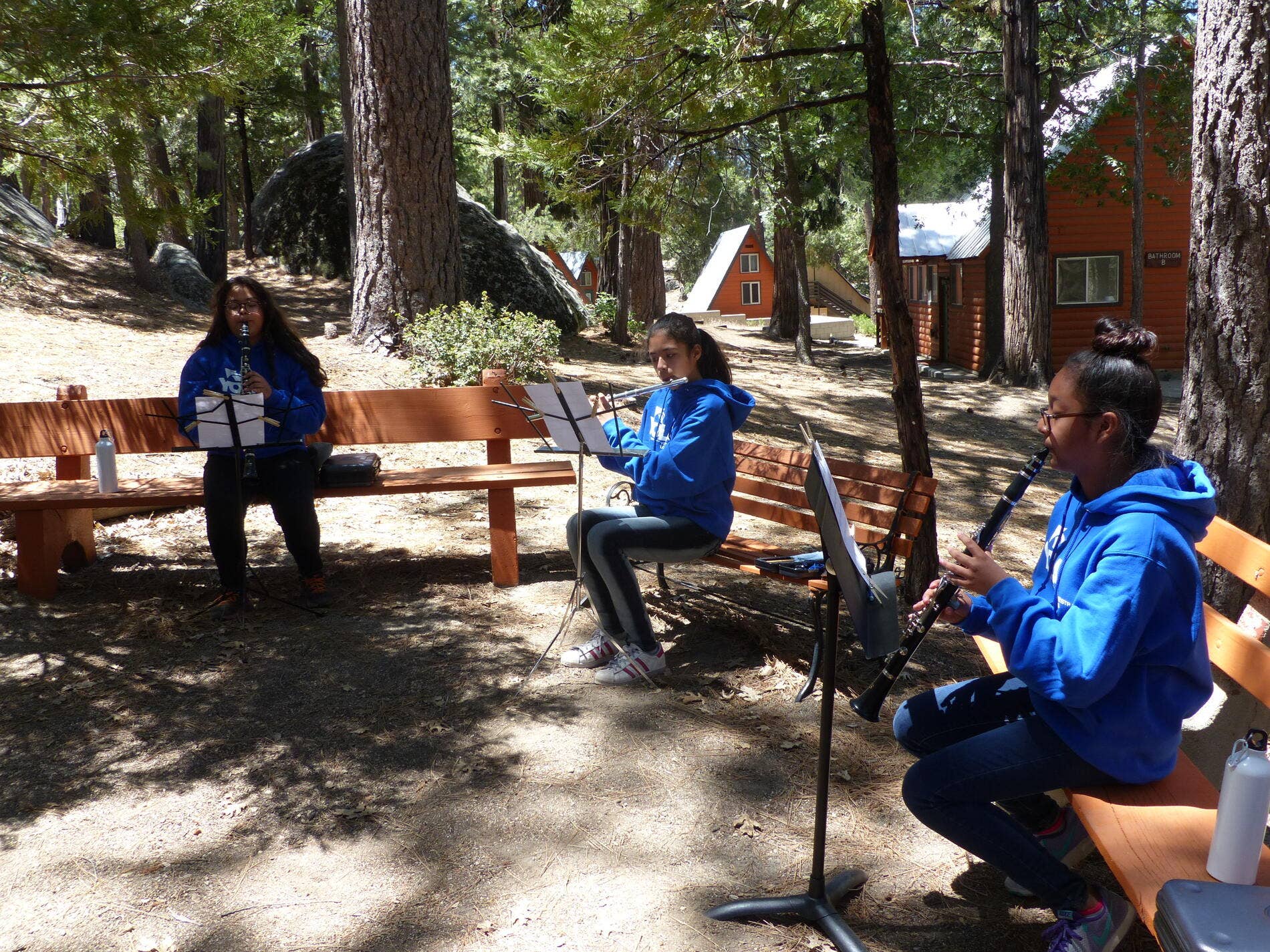 YOLA students play their instruments in the forest during Summer Camp 2017 at Camp Buckhorn in Idyllwild CA.