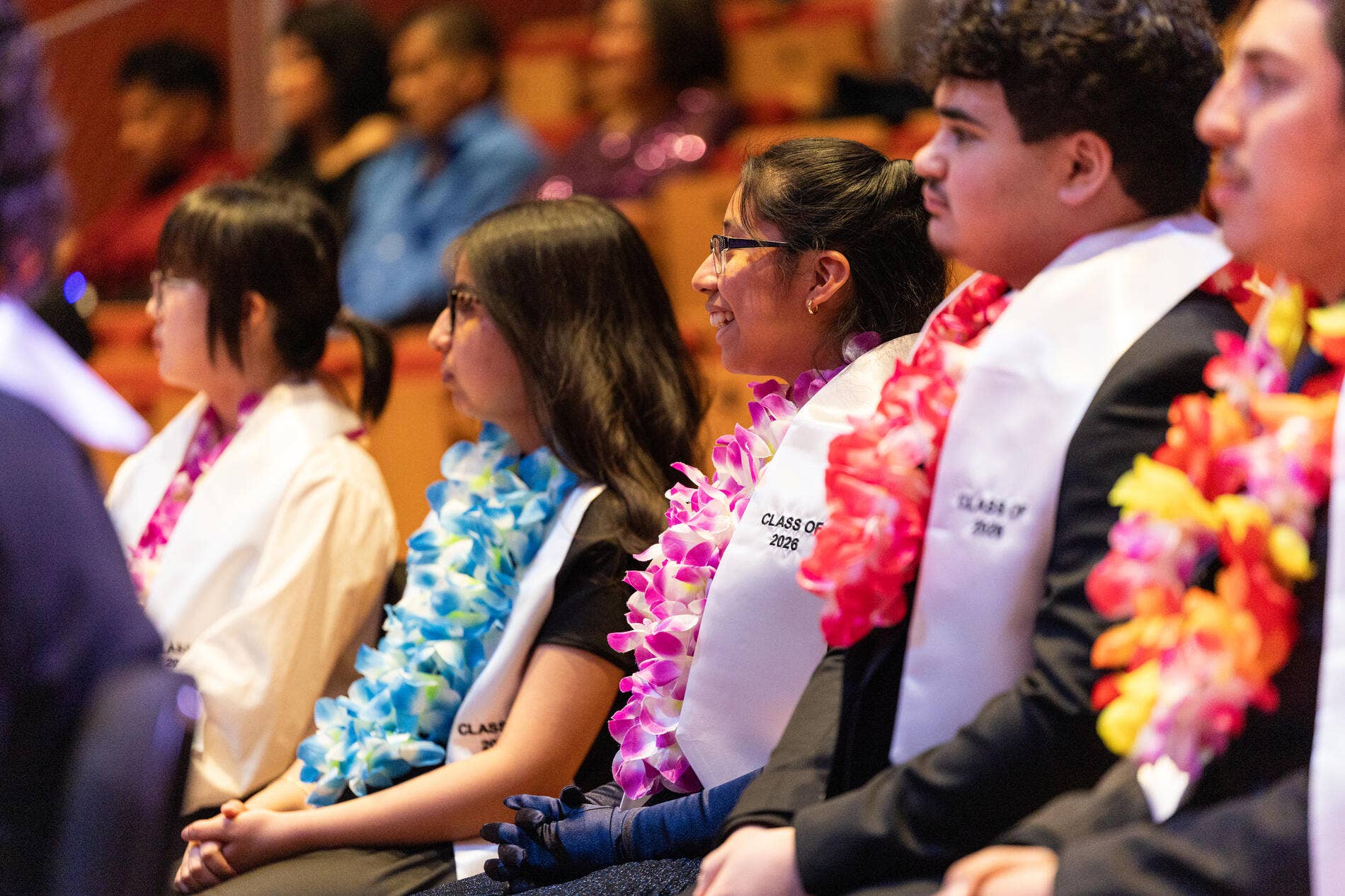 YOLA graduates sit in the audience during their Soirée graduation ceremony.