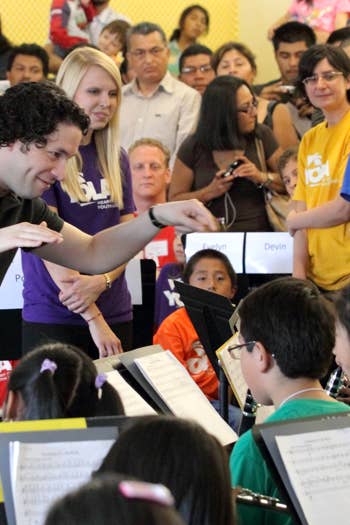 Gustavo Dudamel conducts the YOLA student orchestra at the HOLA hub. 