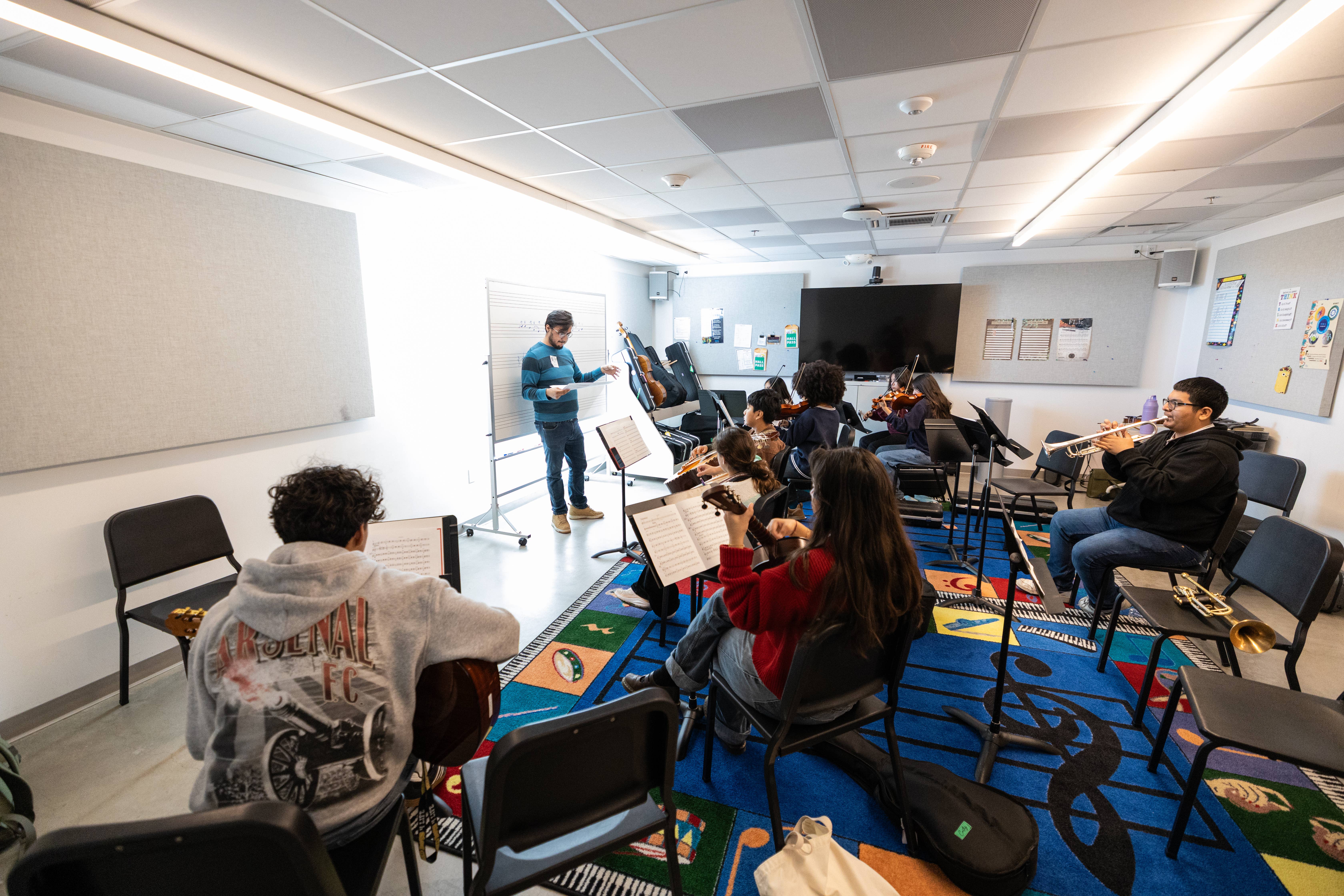 YOLA students rehearse inside a classroom at the YOLA Inglewood campus.