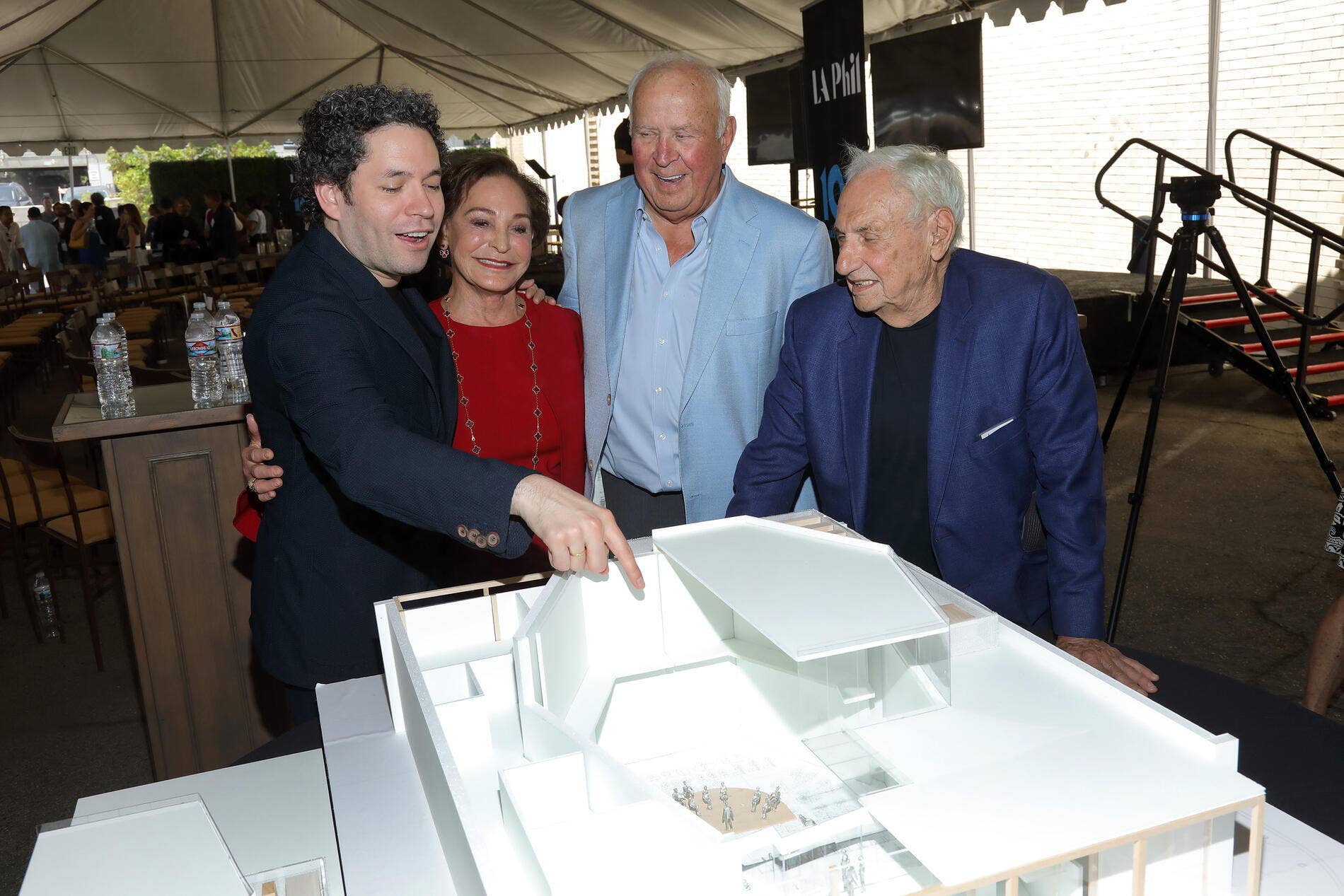 Gustavo Dudamel and Frank Gehry look at an architectural model of the new YOLA at Inglewood Center.