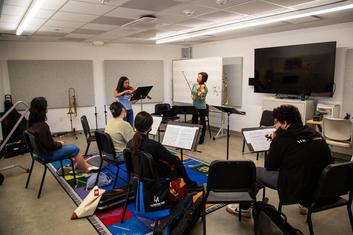 YOLA at Inglewood students practice with Bing Wang during a class. 