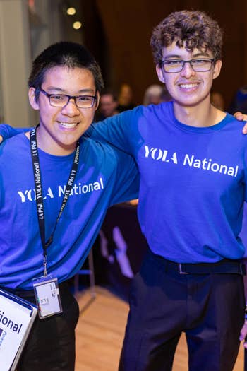 Two YOLA National students pose for a photo during an event at the Walt Disney Concert Hall.