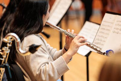 YOLA student plays the flute during a Composer Fellowship Program rehearsal.