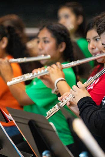 YOLA students play their flute instruments during rehearsal at YOLA Torres.