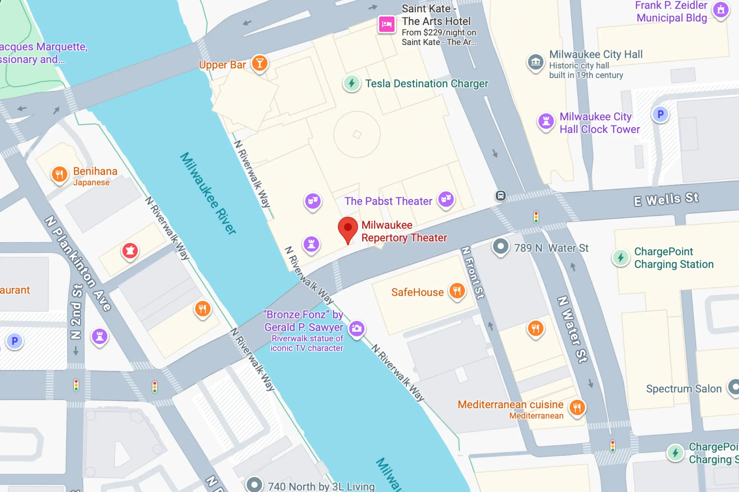 Map of Milwaukee downtown showing landmarks, roads, and icons near Milwaukee Repertory Theater and Fiserv Forum.