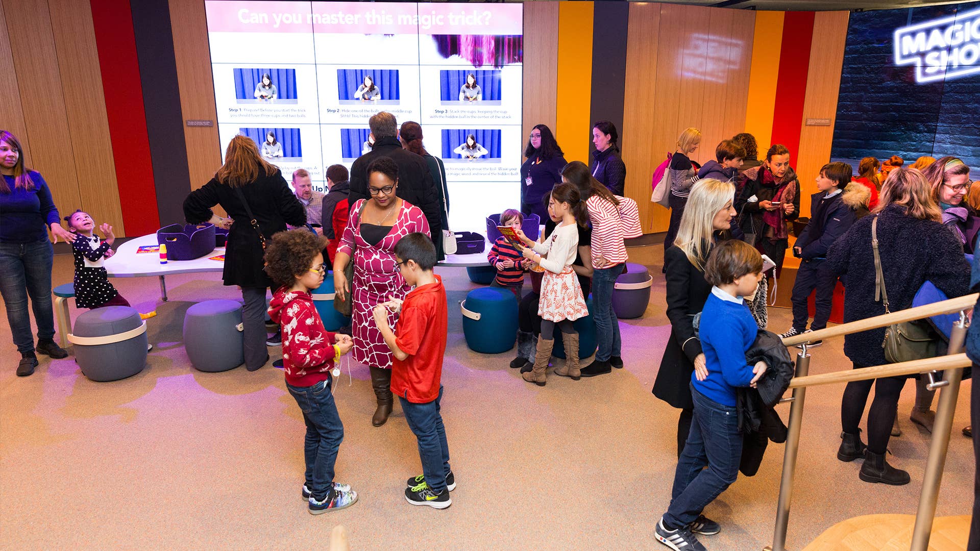 Families gathered in the New Victory Lobby before a show.