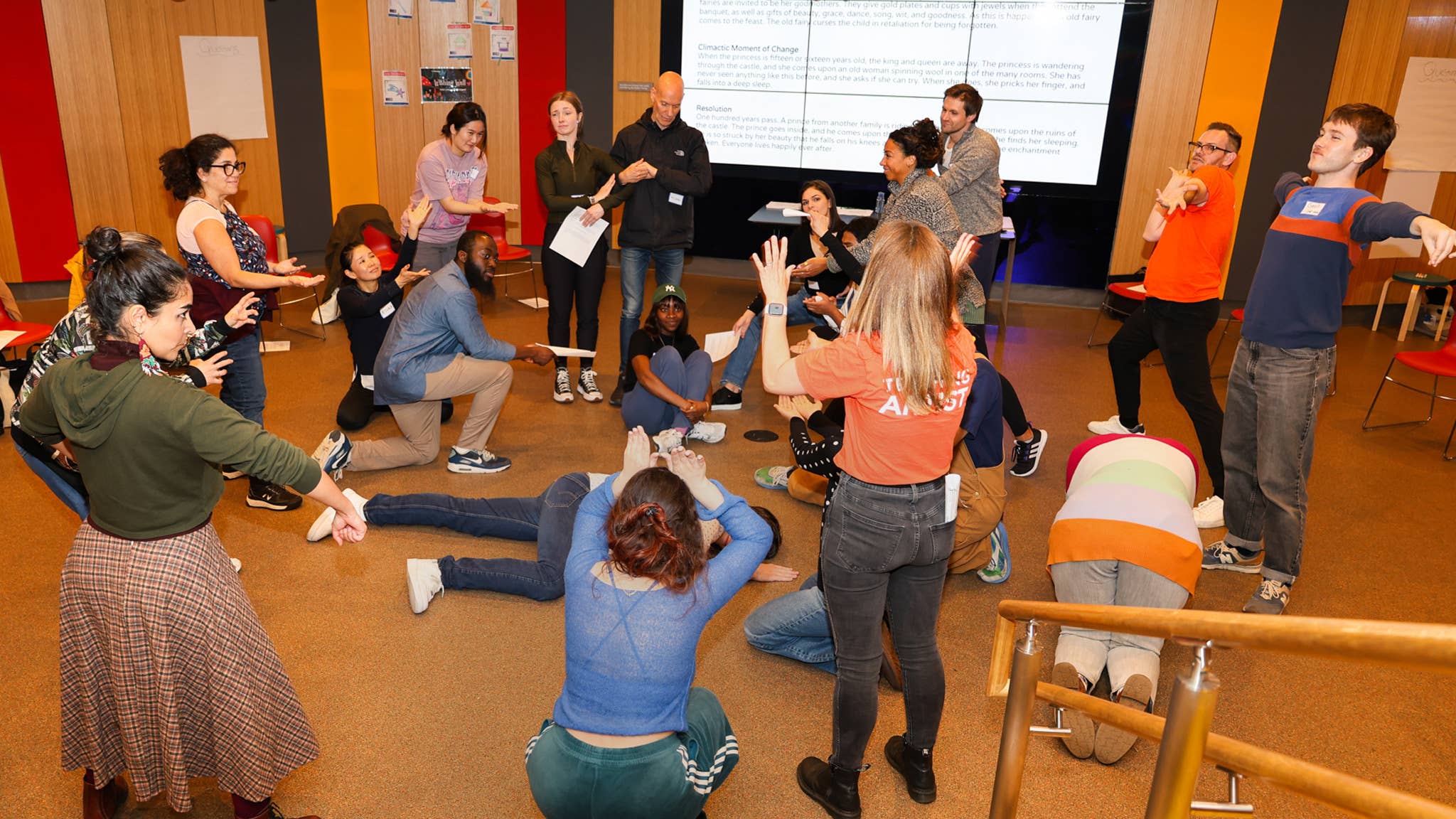 Teaching artist and educators during a learning session in the lower lobby of the New Victory theater
