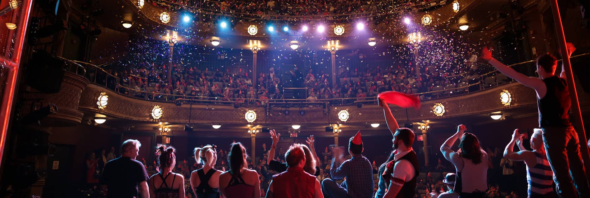 Performers on the stage with confetti everywhere