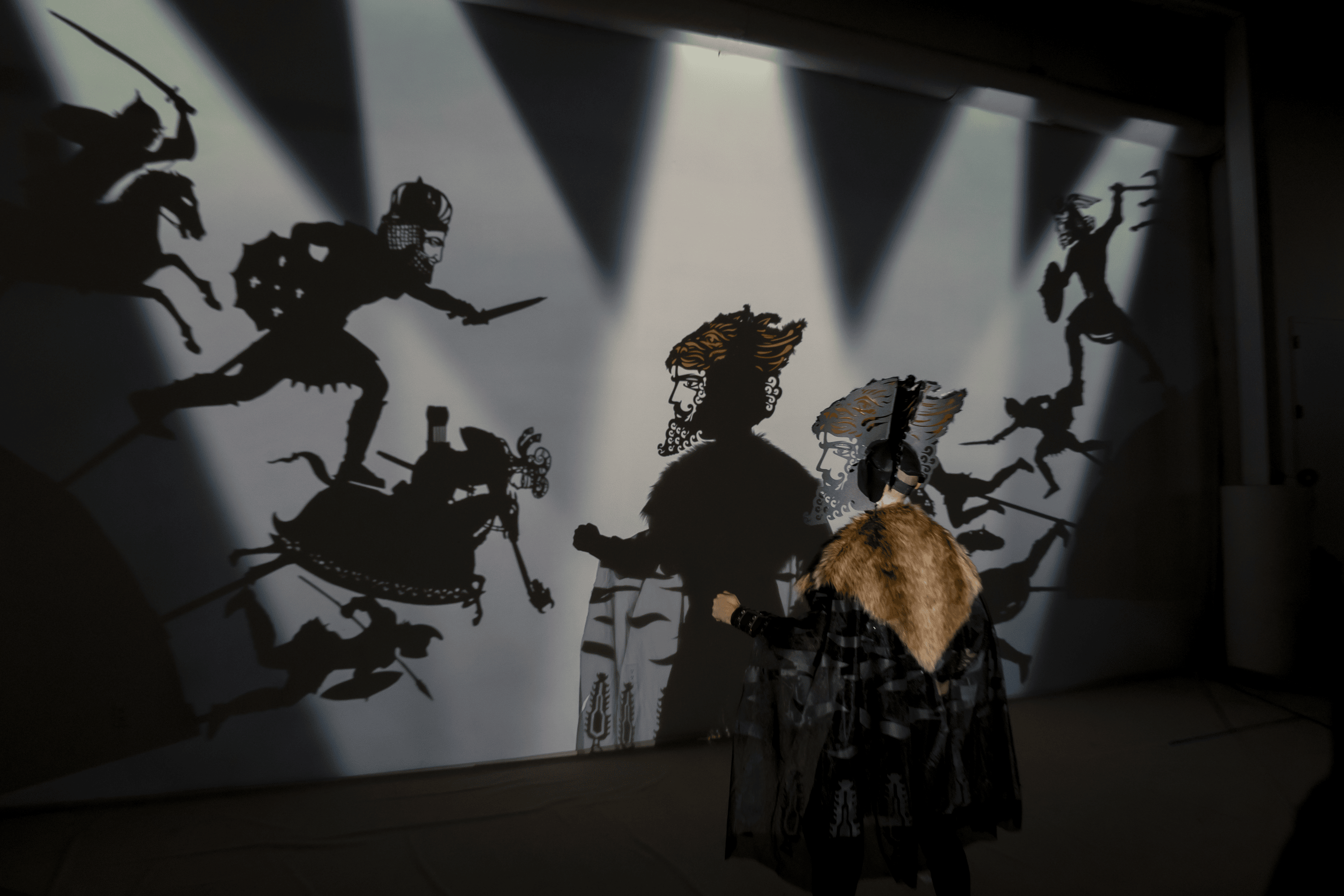 Behind the scenes photo of Song of the North featuring multiple shadow puppets of different sizes