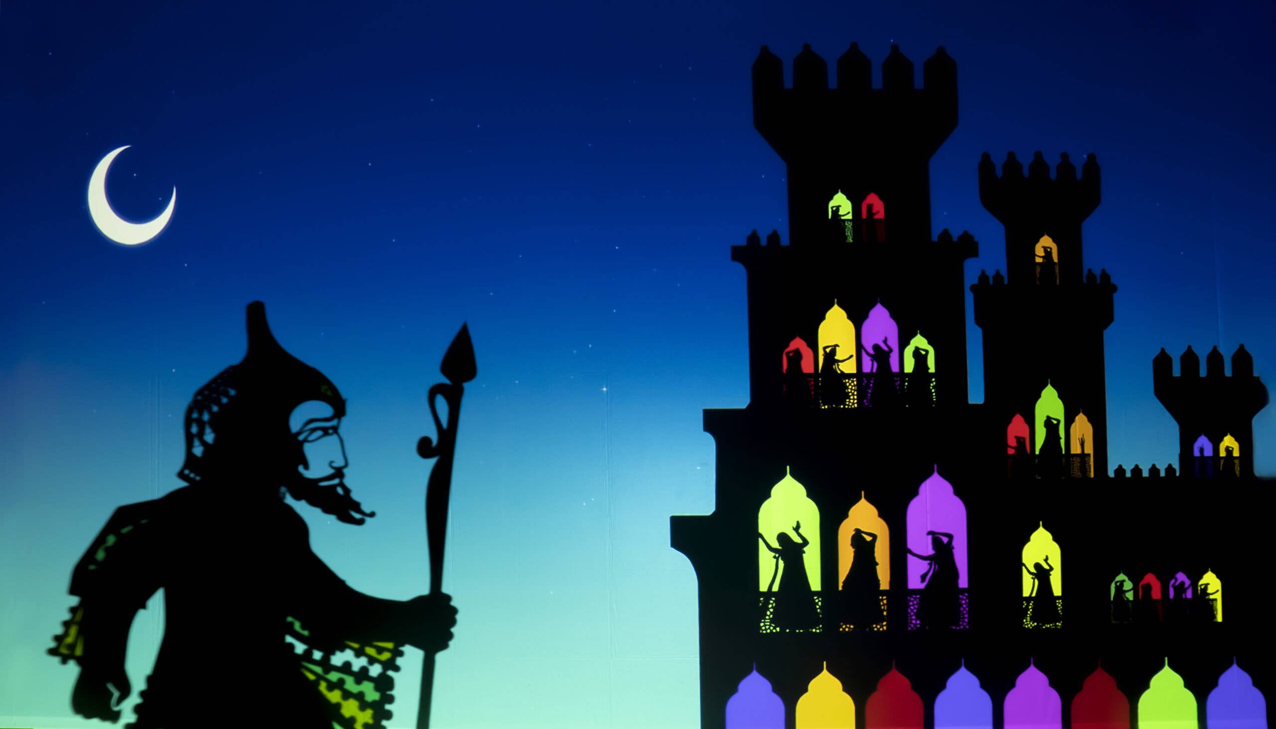 A colorful still of a Persian warrior shadow puppet approaching a lit up palace against a blue night sky