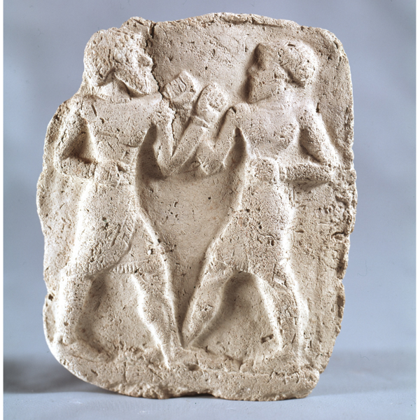 A stone relief of boxers from anicent times